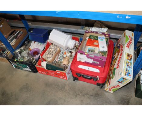 Three boxes of sundry items to include table lamp, postcard album, glass storage jars etc.