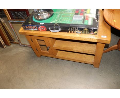 A modern light oak TV stand