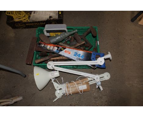 A plastic tray box containing an angle poise style lamp, hand saws, shoe lasts etc