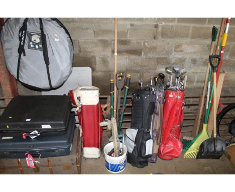 A quantity of long handled gardening tools to include hand saws, rakes, shovels, garden shears etc.