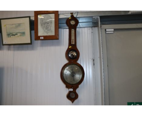 A cased barometer/thermometer