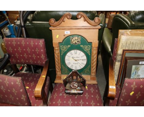 A pine cased wall clock and a cuckoo clock