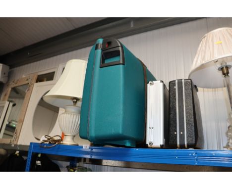 A table lamp and three briefcases