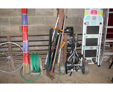 A quantity of gardening tools to include shears, a Woolf Tool three pronged hoe, branch loppers, sash clamp, tree branch prun