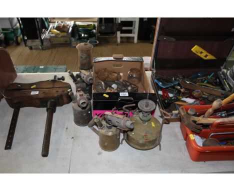 Three blow torches; a Cambrian miners lamp; a Burmos stove and a box of various accessories 