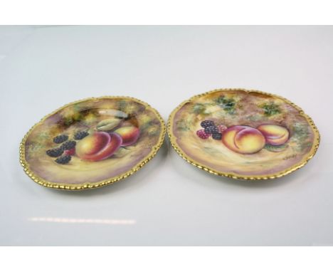 Two Royal Worcester hand painted cabinet plates both with fruit decoration and signed by the artists.