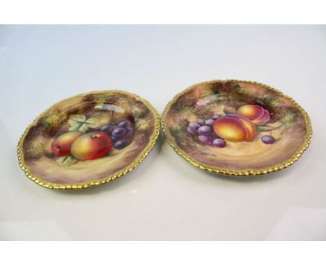 Two Royal Worcester hand painted cabinet plates both with fruit decoration and signed by the artists.