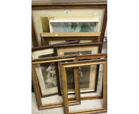 A group of framed prints to include Eric Tunney lion, an oak framed print of terriers chasing rabbit etc.