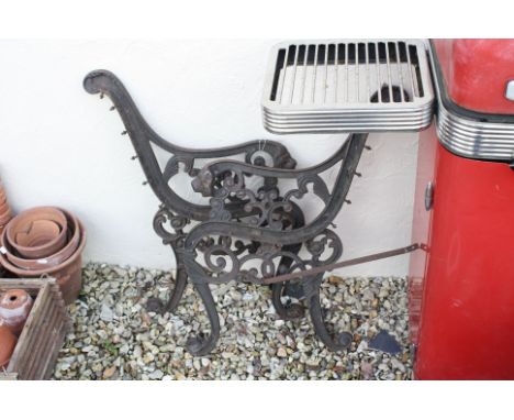 A pair of lion mask  iron bench ends plus three galvanised buckets and a pruner