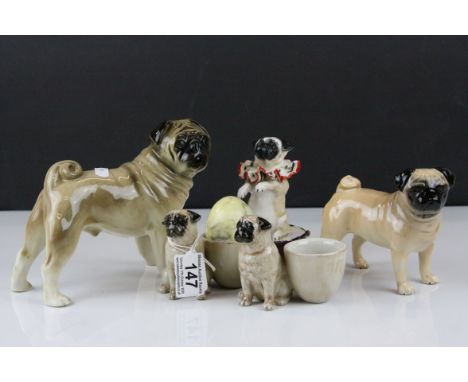 Beswick Pug ' Champion Cutmil Cupie ' together with Two further Ceramic Pugs and a Pair of Ceramic Pug Egg Cups