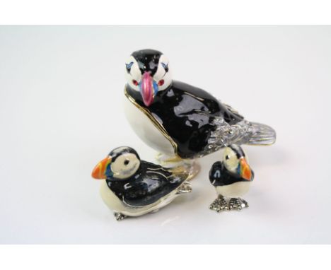 Two Hallmarked sterling silver and enamel Puffin figures together with a trinket box in the form of a Puffin.