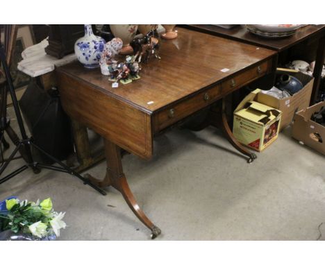 Regency Inlaid Mahogany Sofa Table with two drawers, raised on rectangular end supports with sabre legs and brass lion paw ca