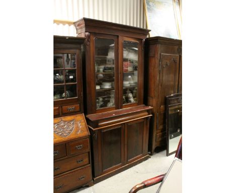 Victorian Mahogany Bookcase / Cupboard, the upper section with two glazed doors over a single cushion drawers and two cupboar