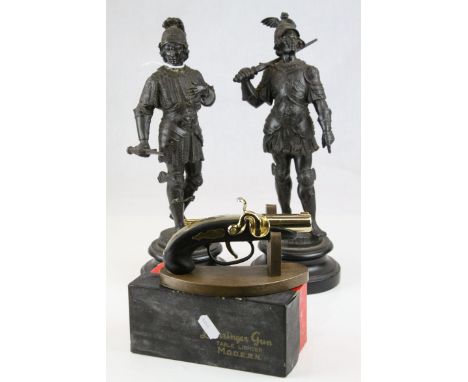 A pair of spelter figures of ancient warriors with broken swords and a boxed Derringer Table Lighter,