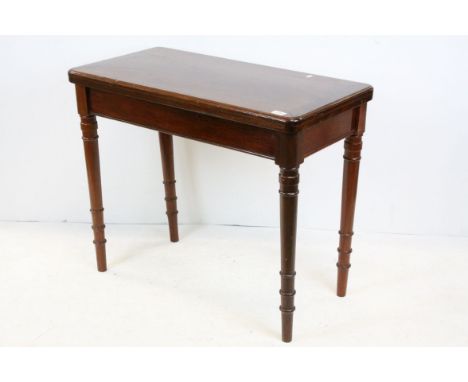 19th century Mahogany Fold-Over Card Table opening to reveal a blue baise playing surface, raised on turned legs, 91cms wide 