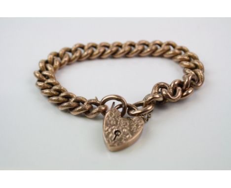 A vintage fully hallmarked 9ct rose gold curb link bracket with matching heart shaped lock.
