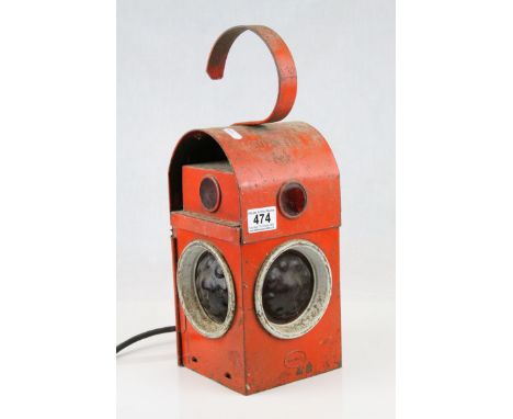 A vintage red road workmens lamp converted to electric.