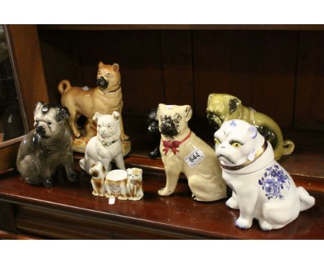 Collection of Eight 19th century and Later Ceramic Pugs, tallest 23cms