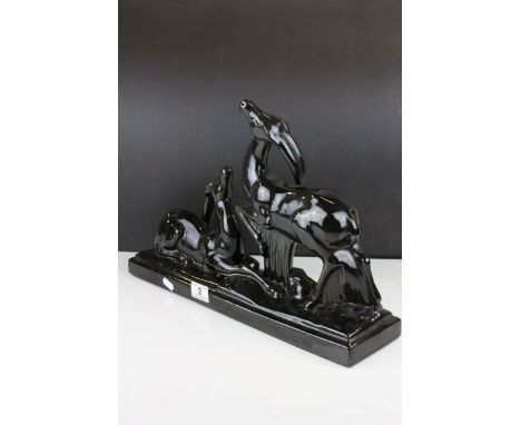 In the manner of Charles Lemanceau for St. Clement, Art Deco Black Glazed Ceramic Antelopes, 46cms long