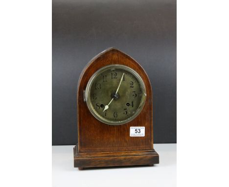 Early 20th century 8 Day Mantle Clock contained in an Oak Arched Case with Brass Face, 30cms high