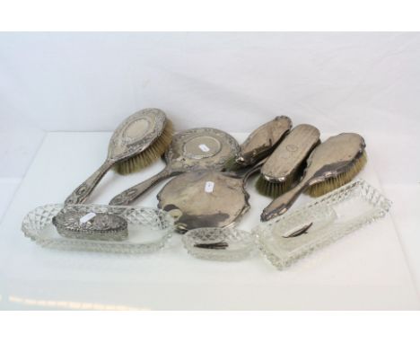 A collection of fully hallmarked sterling silver vanity items to include Brushes, Mirrors and Pin Dishes.