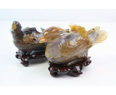 A pair of oriental carved stone trinket box ornaments in the form of ducks.