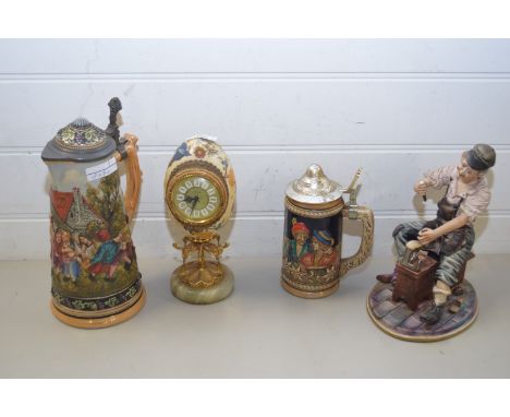 LARGE GERMAN POTTERY BEER STEIN DECORATED WITH FIGURES TOGETHER WITH A FURTHER SMALLER EXAMPLE, A GERMAN COMPOSITION MANTEL C