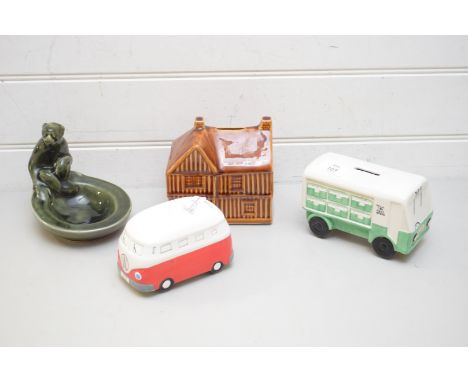 TWO NOVELTY BOXES, ONE FORMED AS A MILK FLOAT, THE OTHER AS A VW CAMPERVAN AND A FURTHER HOLKHAM POTTERY MONEY BOX FORMED AS 