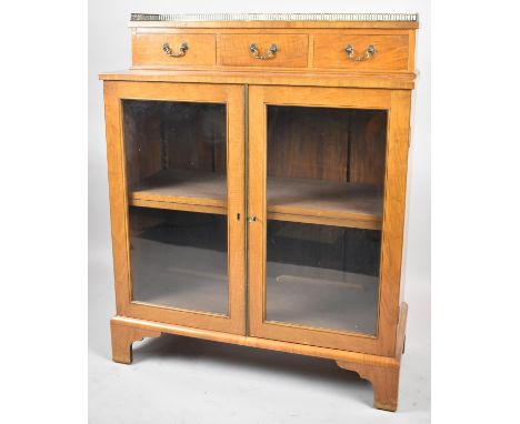 An Edwardian Satinwood Chiffonier with Glazed Shelved Base and Raised Ormolu Galleried Top Section with Three Short Drawers, 