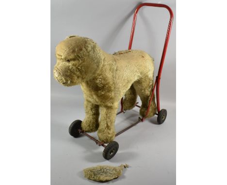A Vintage Pedigree Child's Push Along Toy In the Form of a Dog, Worn and Ear Detached 