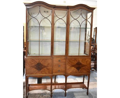 A Nice Quality Inverse Break Fronted Edwardian Walnut and Mahogany Display Cabinet with Shaped Stretcher Shelf, Three Centre 