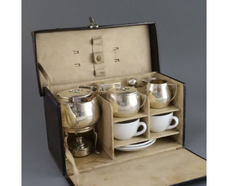 A cased early 20th century German 935 standard silver and porcelain travelling picnic set, fitted with kettle and burner, thr