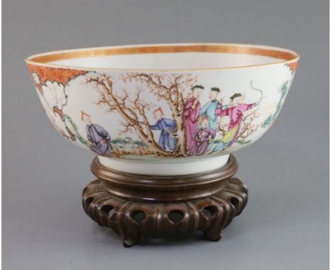 A Chinese export famille rose bowl, Qianlong period, painted with court figures in a garden and birds on branches, within iro