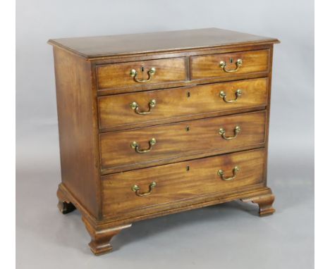 A George III mahogany chest, of two short and three graduated long drawers, on ogee bracket feet, fitted castors, W.2ft 10in.