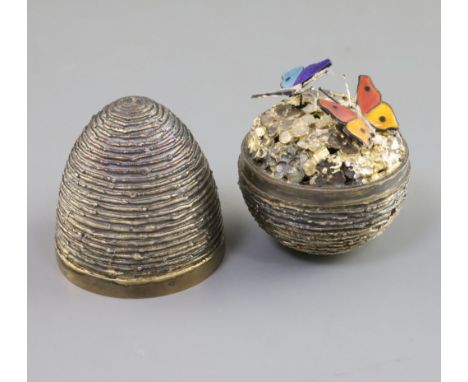 A 1970's textured silver gilt surprise egg by Stuart Devlin, no. 256, opening to reveal two enamelled butterflies, one en tre