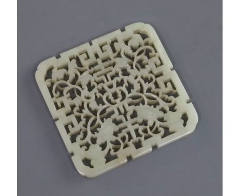 A Chinese pale celadon jade square plaque, 19th century, pierced and carved with 'shou' characters, lotus flowers and scrolli