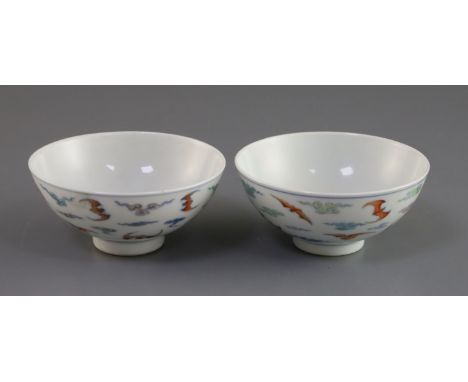 A pair of Chinese doucai 'bat' bowls, Yongzheng mark, Republic period, painted with twelve bats amid scrolling clouds, D. 9.7