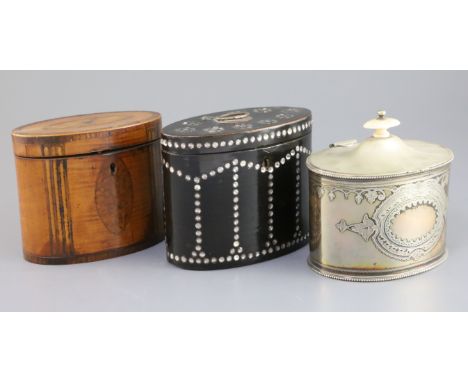 A George III crossbanded satinwood oval tea caddy, with paterae inlay to the top, 5.5in., a papier mache oval caddy with inse