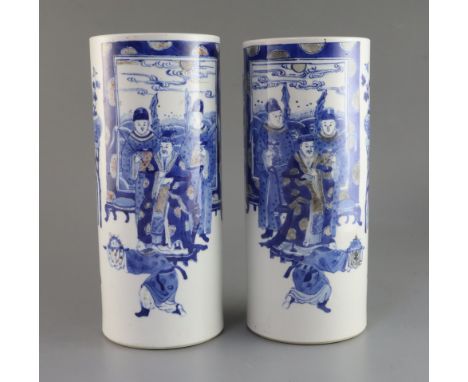 A pair of Chinese underglaze blue and copper red cylindrical hat stands, late 19th century, each painted with court figure sc