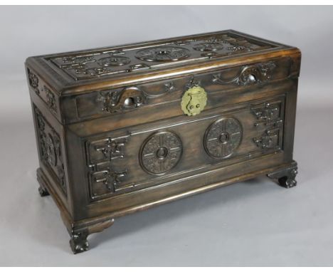 A Chinese hongmu archaistic 'chilong and medallion' chest, c.1900, with camphorwood lining, on four claw and ball feet, H. 63