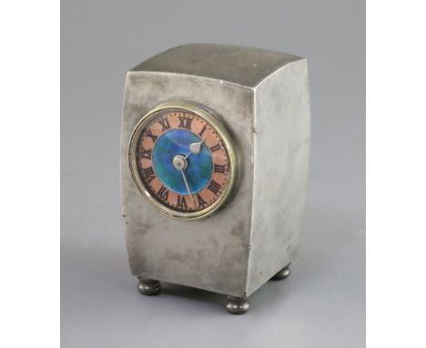 A Liberty &amp; Co. Tudric pewter and enamel timepiece, model no.0756, of swollen rectangular form on bun feet with enamelled