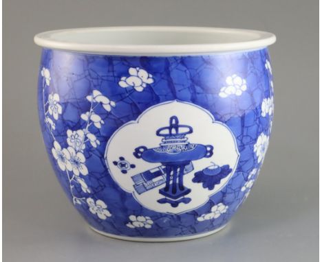 A small Chinese blue and white 'Antiques' jardiniere, Kangxi period, painted with scholar's objects to quatrefoil reserves, o