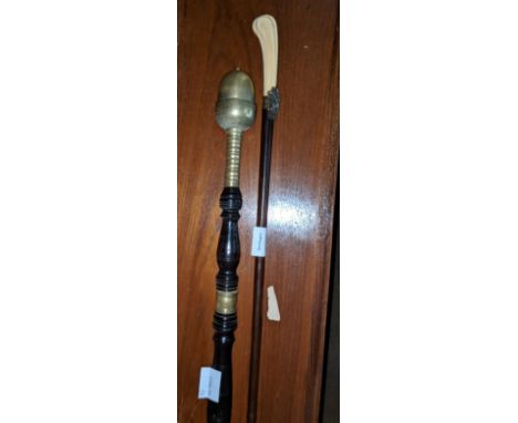 A 19th century French ivory handled mahogany cane handle 4.3in., and early 19th century brass and mahogany tipstaff