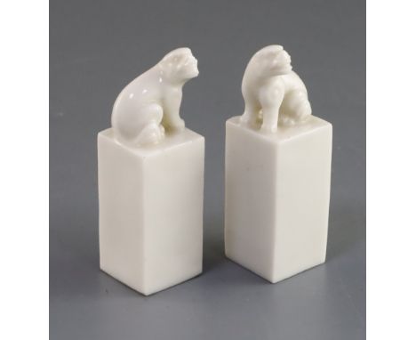 PLEASE NOTE Republic period NOT Kangxi, A pair of Chinese blanc de chine seals, Kangxi period, each surmounted by a lion-dog,