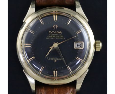 A gentleman's 1960's steel and gold plated Omega Constellation automatic 'pie pan' black dial wrist watch, with baton numeral