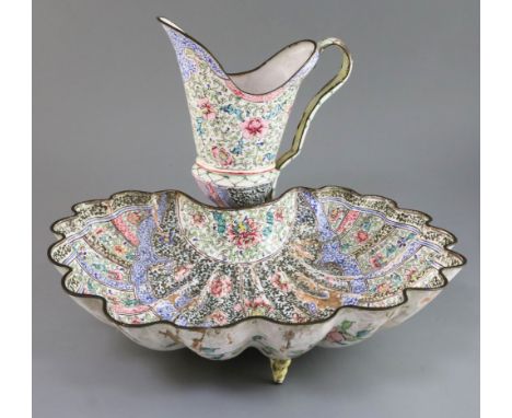 A Chinese Canton enamel 'shell' basin and ewer, mid 18th century, decorated with alternating panels of flowers and scrolls, t