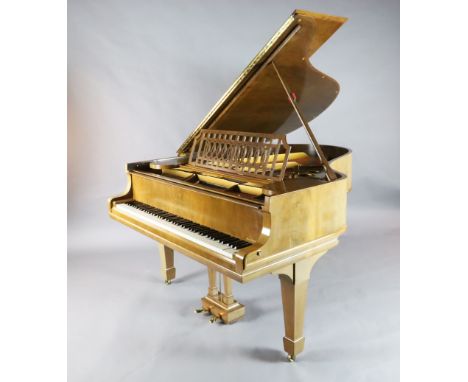 A Steinway &amp; Sons figured walnut boudoir grand piano, with iron frame, with cast inscription 'Miniature Patent Grand Cons