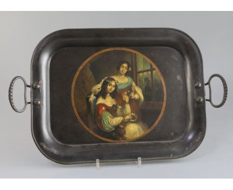 A Regency toleware tray, with iron loop handles and decorated with a portrait of two young ladies holding floral garlands, ov