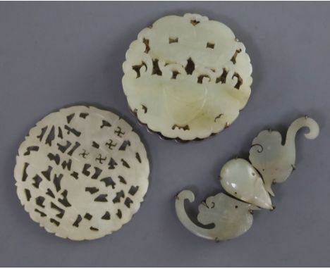 Two Chinese pale celadon jade plaques and a hair ornament, 19th century, the plaques carved and pierced with a butterfly and 