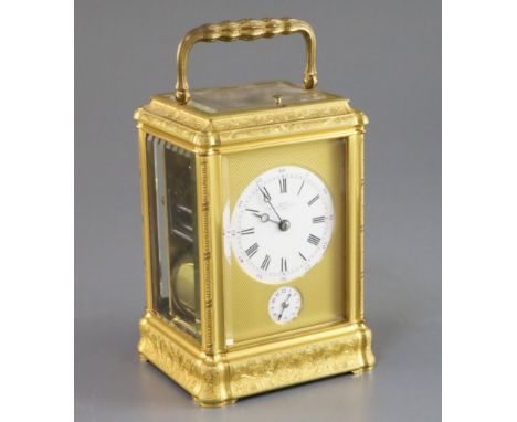 A late 19th century French ormolu quarter repeating carriage alarum clock, with floral scroll engraved gorge case and enamell